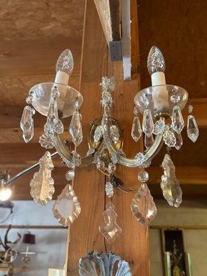 a crystal chandelier hanging from the ceiling in a room