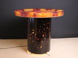 a table that has a lamp on top of it