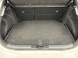 a trunk of a white car with its trunk open