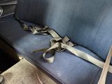 a seat belt that is attached to the back of a car