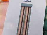 a package of multicolored hair ties sitting on a table