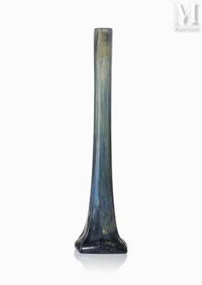 a glass vase that is sitting on a white surface
