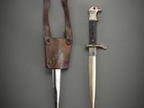 a knife and a knife holder on a table