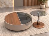 two tables that are sitting on a rug in a room