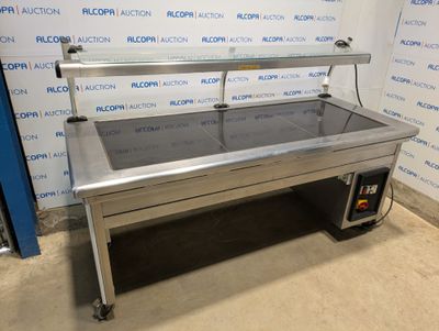 une photo d'une table en acier inoxydable avec un plateau en verre