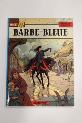 un livre sur lequel figure l'image d'une femme à cheval