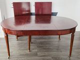 a large table with two chairs on top of it