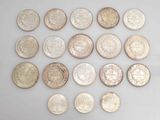 several different types of coins are arranged in a circle on a white surface