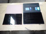 two laptops that are sitting on a wooden table