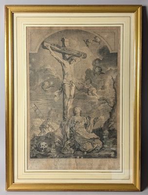 un vieux dessin représentant Jésus sur la croix, dans un cadre doré