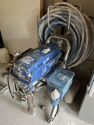 a blue machine that is sitting in the corner of a room