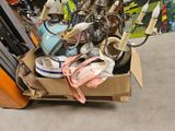 a cardboard box filled with assorted items in a store