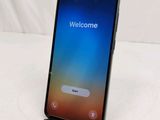 a close up of a phone with a welcome screen on it