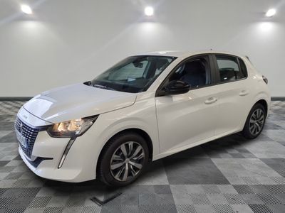 a white car is parked in a room with a checkered floor