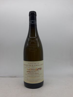 la bouteille de vin est posée sur une surface blanche