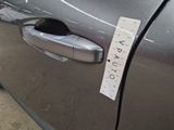 a sticker on the door handle of a car that has a sticker attached to it