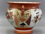 a large vase with a heart shaped handle on it