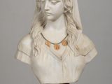 a white bust of a woman with a veil on her head