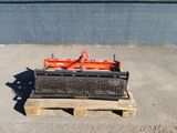 an image of a fork attachment on a pallet in a parking lot