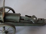 a small model of a machine gun on a table