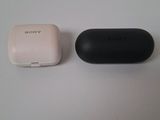 an image of a white and black device sitting next to each other on a table