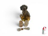 an image of a dog statue sitting on top of a table next to a bottle of perfume