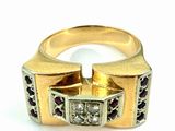 an image of a gold ring with a diamond and garnets