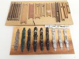 many different types of tools on a wooden board