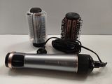 a hair dryer and a blow dryer sitting on a table