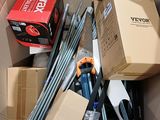 a cardboard box filled with tools and other items