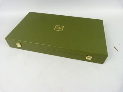 a green box that is sitting on a white table