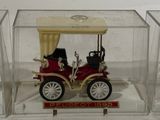 a small model of a car in a clear box