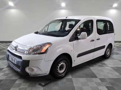 the small white van is parked on a checkered tile floor
