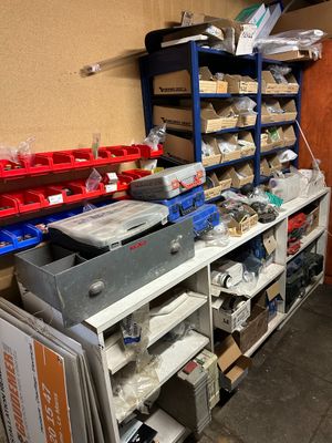 a room with a lot of items on the shelves