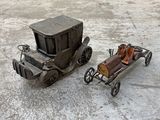 two toy cars that are sitting next to each other
