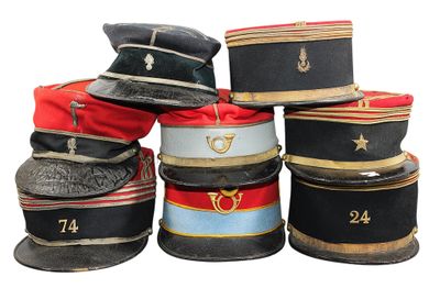 several hats are stacked on top of each other on a white surface
