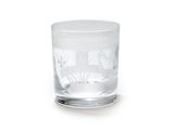 a glass with a design on it on a white surface