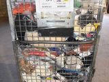 a metal cart with a lot of items inside of it