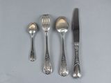 four forks, a knife, and a spoon on a table