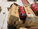 two red fire extinguisors sitting on top of boxes