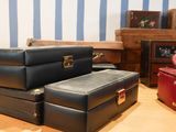 several pieces of luggage are stacked on top of each other on the floor