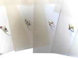 three different pictures of a ring on a white surface