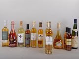 many bottles of wine that are lined up on the table