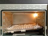 a toaster oven with a tray of food inside of it