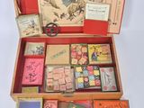 a wooden box filled with different types of stamps and stamps