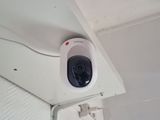 a small camera mounted on the ceiling of a room