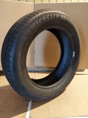 tires on a cardboard box with a cardboard box in the background
