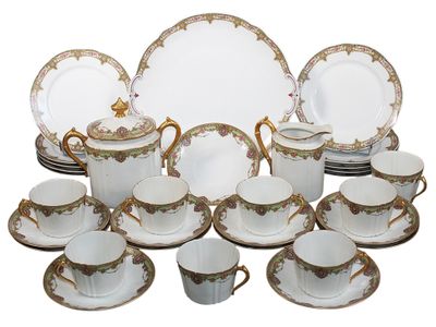 a lot of plates and cups and saucers on the table