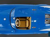 an overhead view of a blue sports car with the hood down