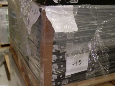 a stack of televisions wrapped in plastic on a pallet